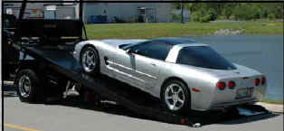 Vehicles front wheels are on the carrier